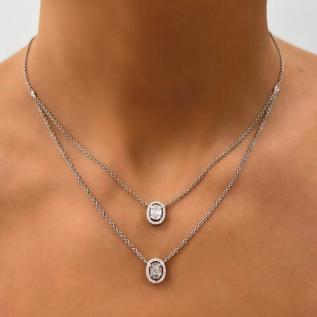 layered diamond pendant necklace with baguette centers and brilliant round diamond halos